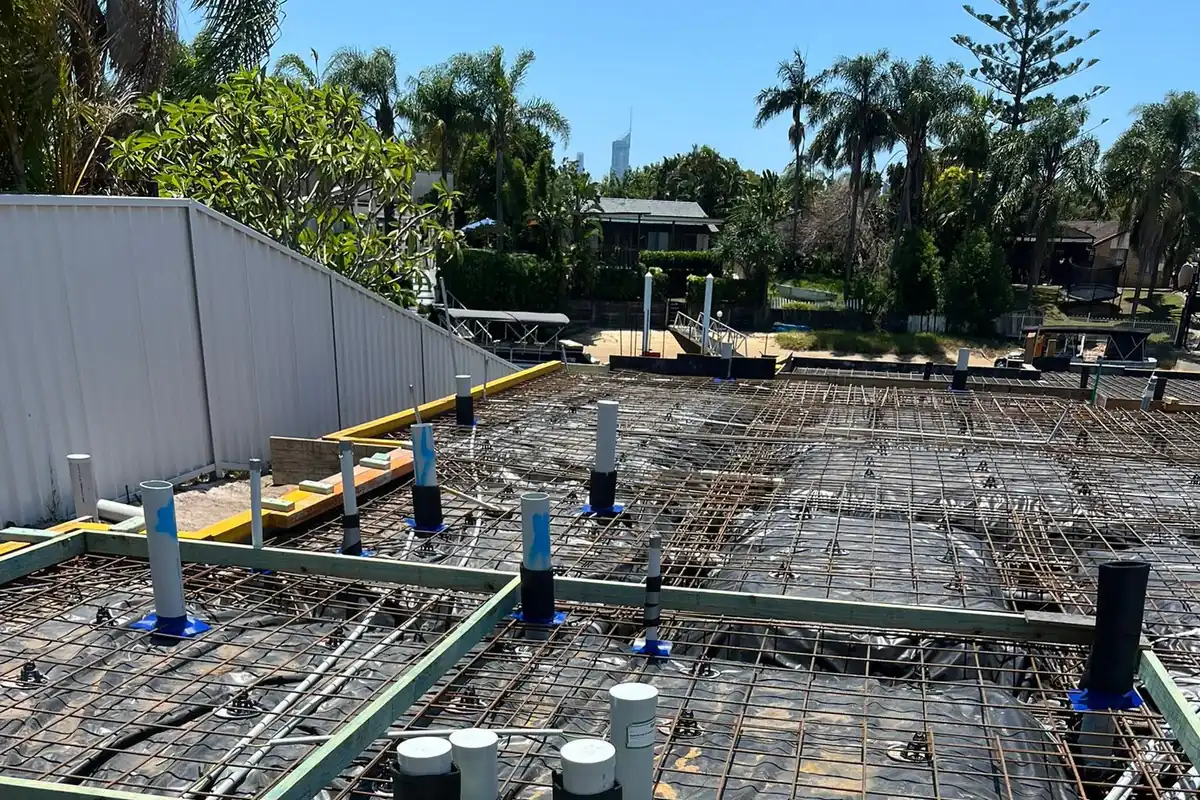 Termite reticulation risers installed across a prepared slab before the concrete pour