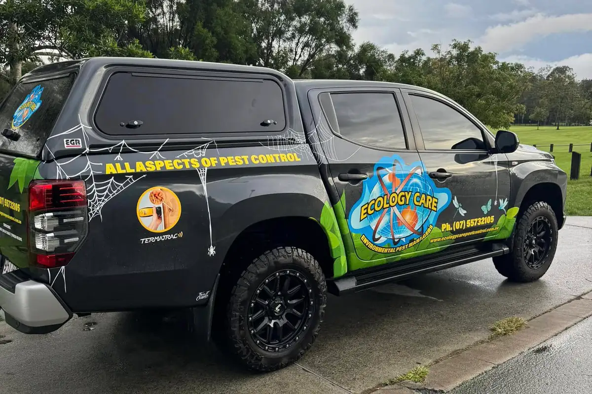 The signwritten Ecology-Care service vehicle parked on the Gold Coast